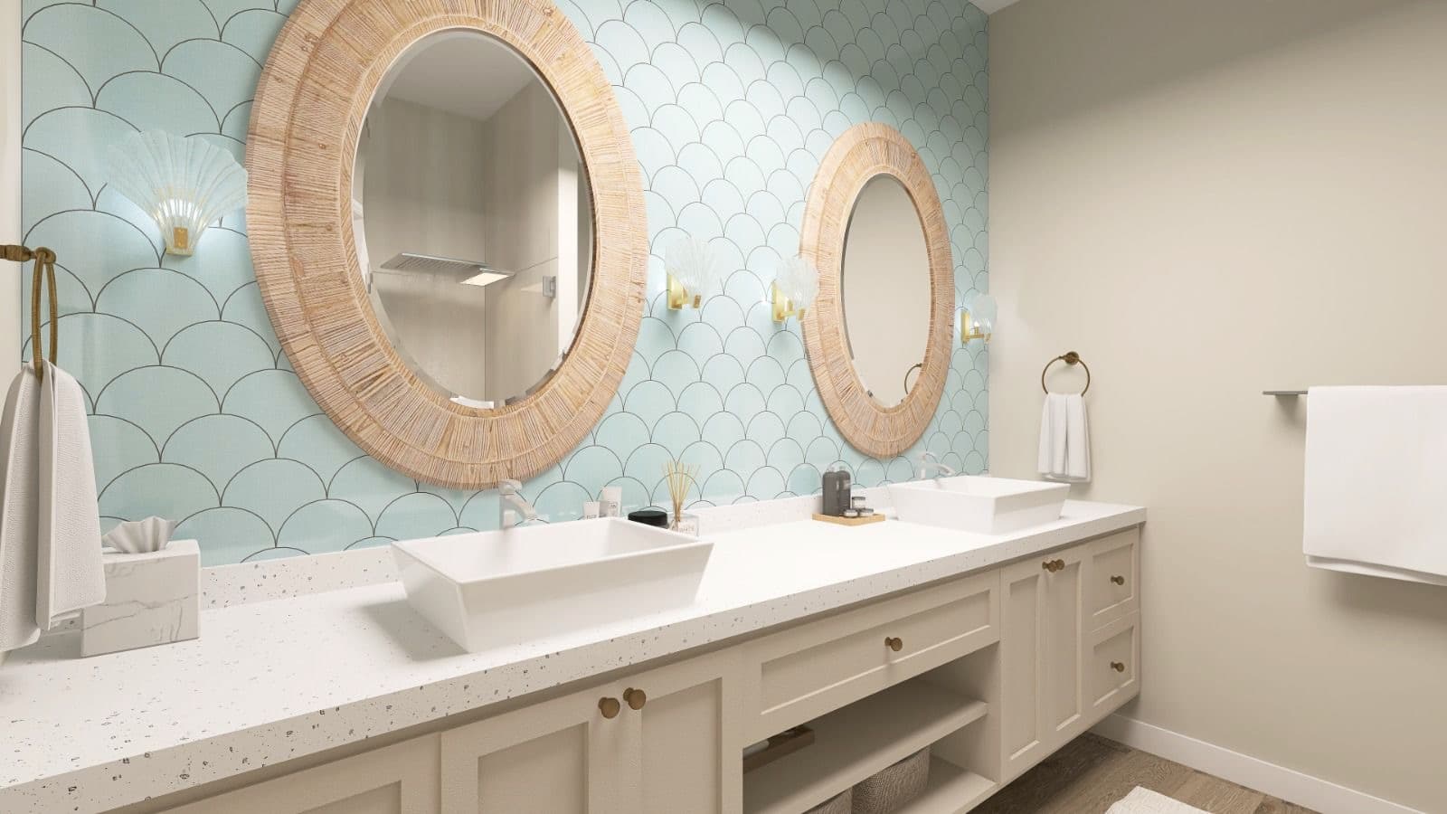 Bathroom vanity with woven mirrors, scalloped wall finish, brass accents, and integrated lighting