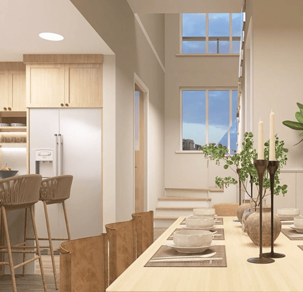 Open dining area connecting the kitchen, circulation path, and double-height living space